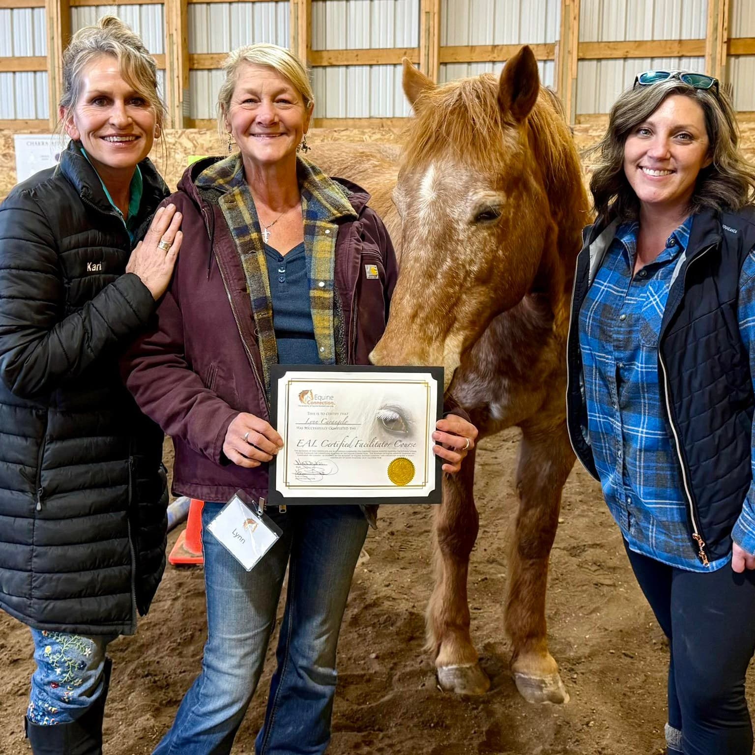 Participants celebrating an Equine Assisted Learning milestone